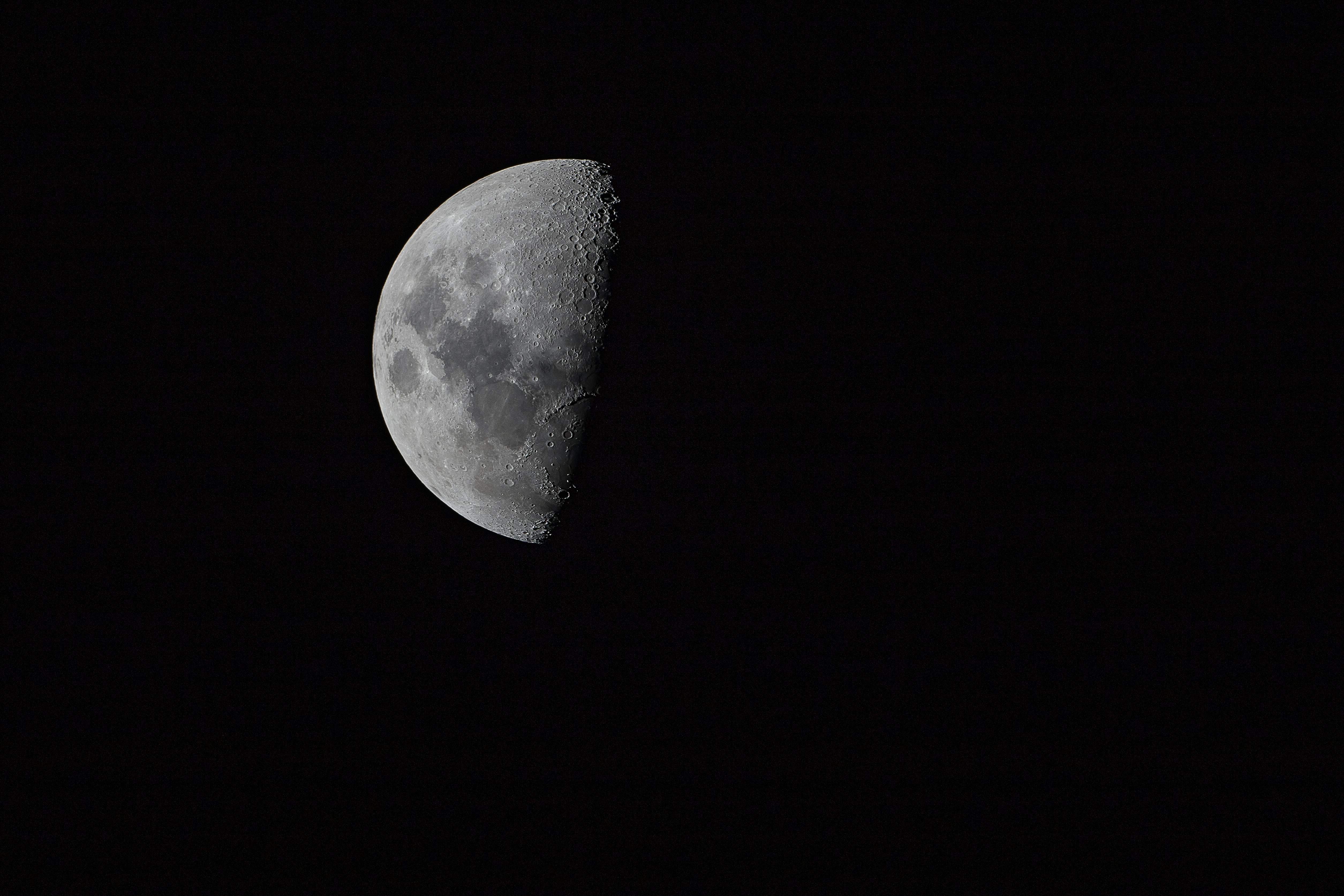 half moon on pitch dark sky